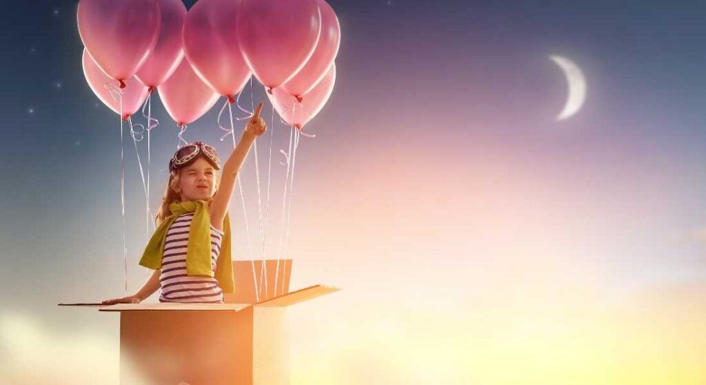 girl floating in box with balloons up into night sky