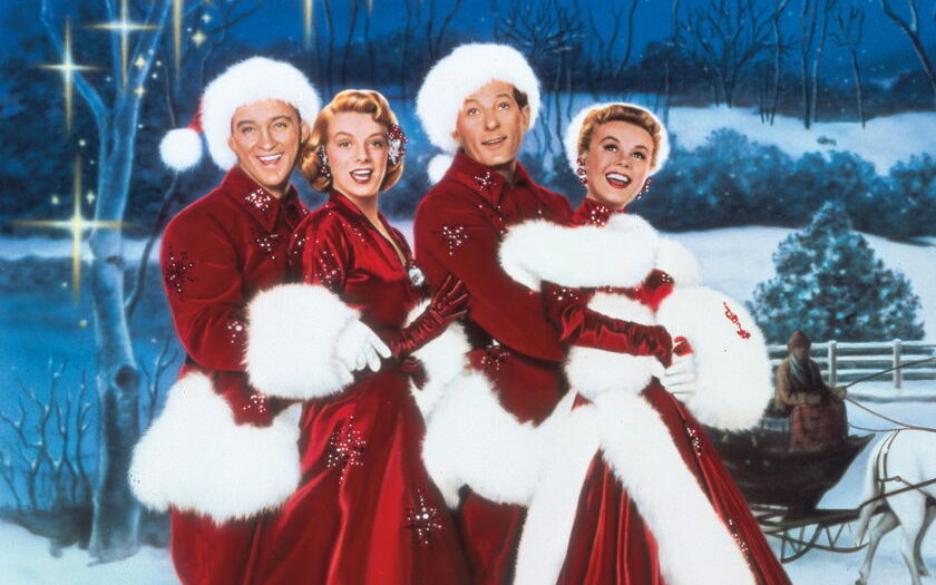 the four main cast members of white christmas in mr. and mrs. claus outfits